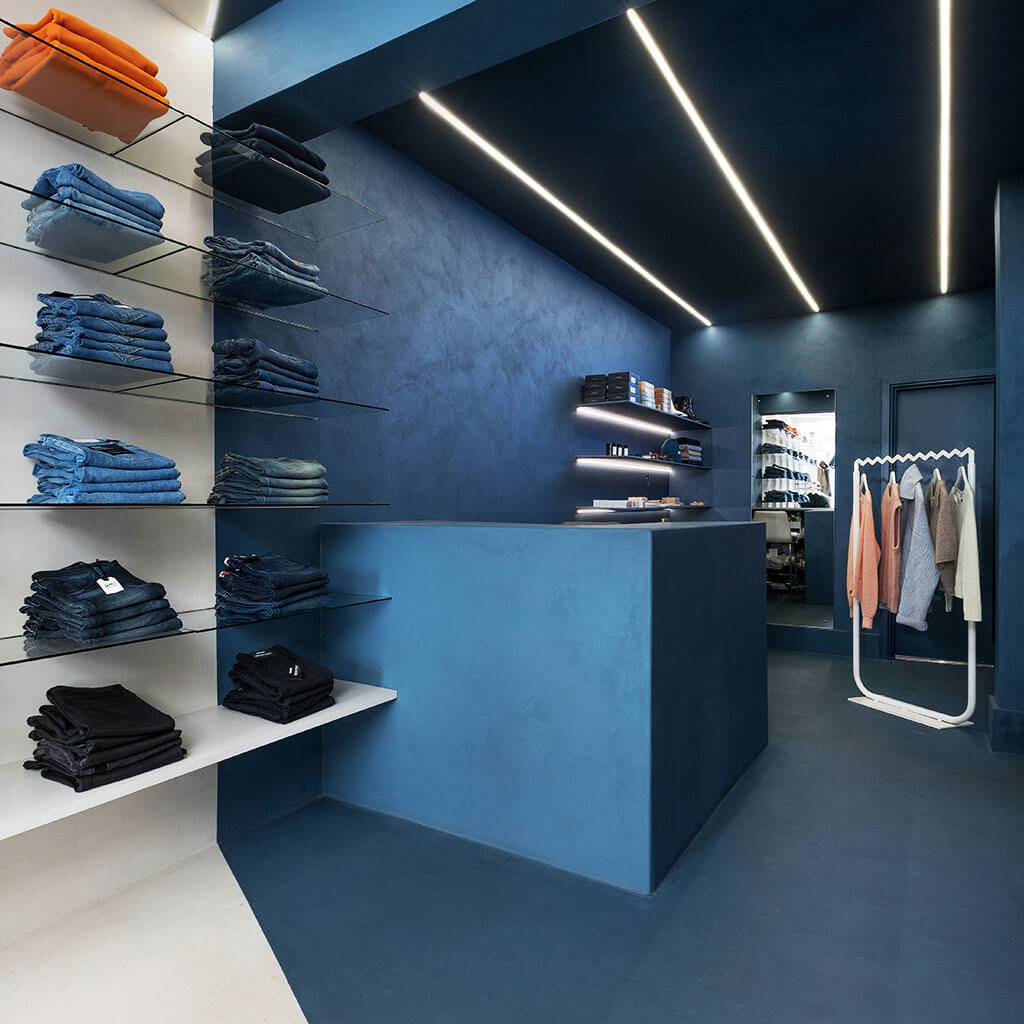 Blauwe betonlook wand winkel